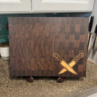 Wooden cutting board with knife design on a concrete floor