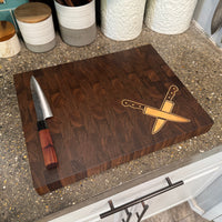 Wooden cutting board with knife design on a kitchen counter