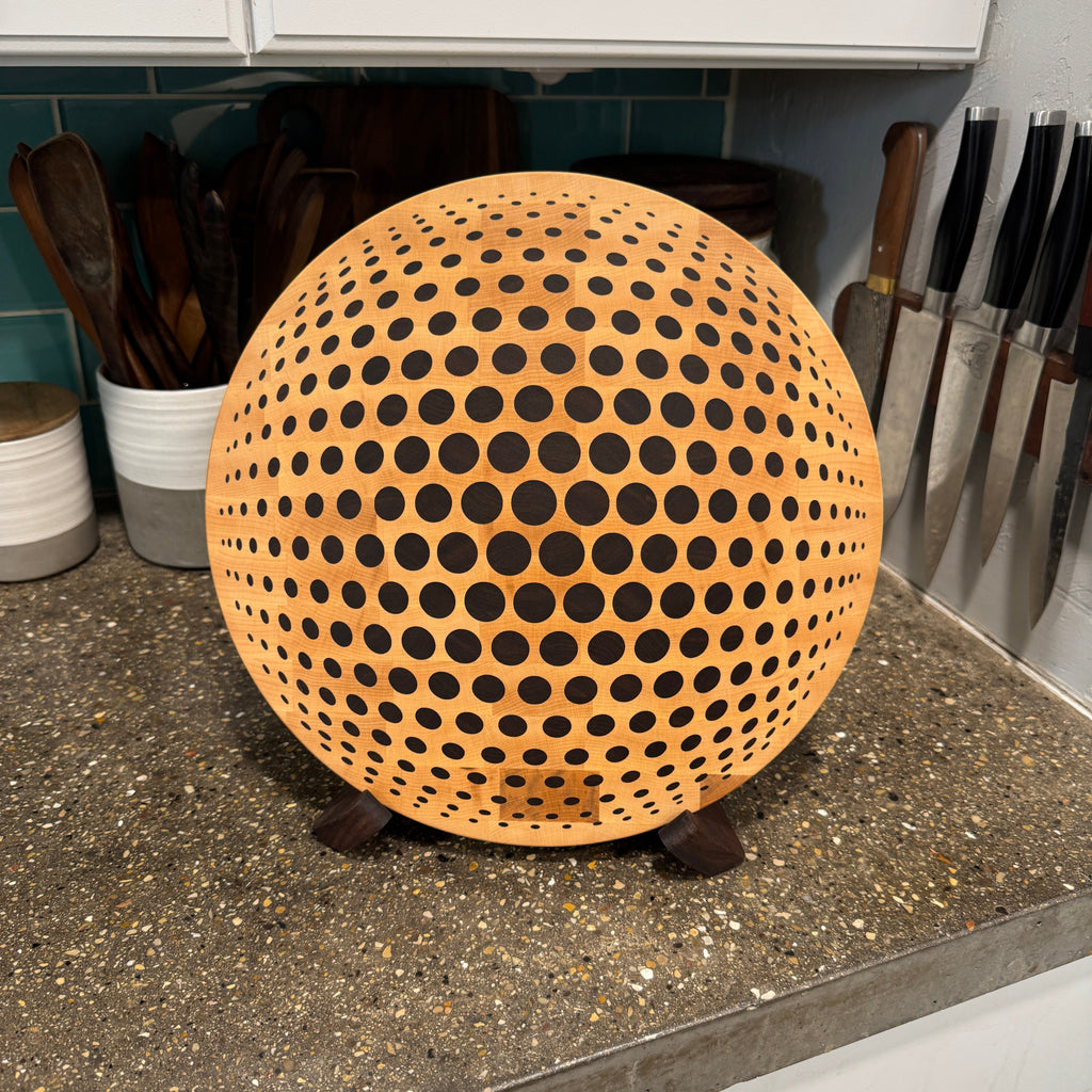 round wooden cutting board on counter