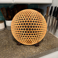 round wooden cutting board on counter